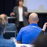 Audience engaged in the presentation